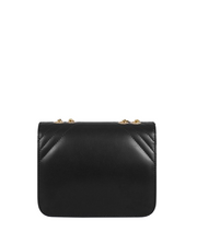 Cross-body bag with black houndstooth chain