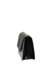 Cross-body bag with black houndstooth chain